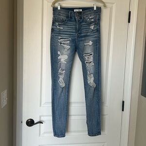 High rise double button skinny jeans